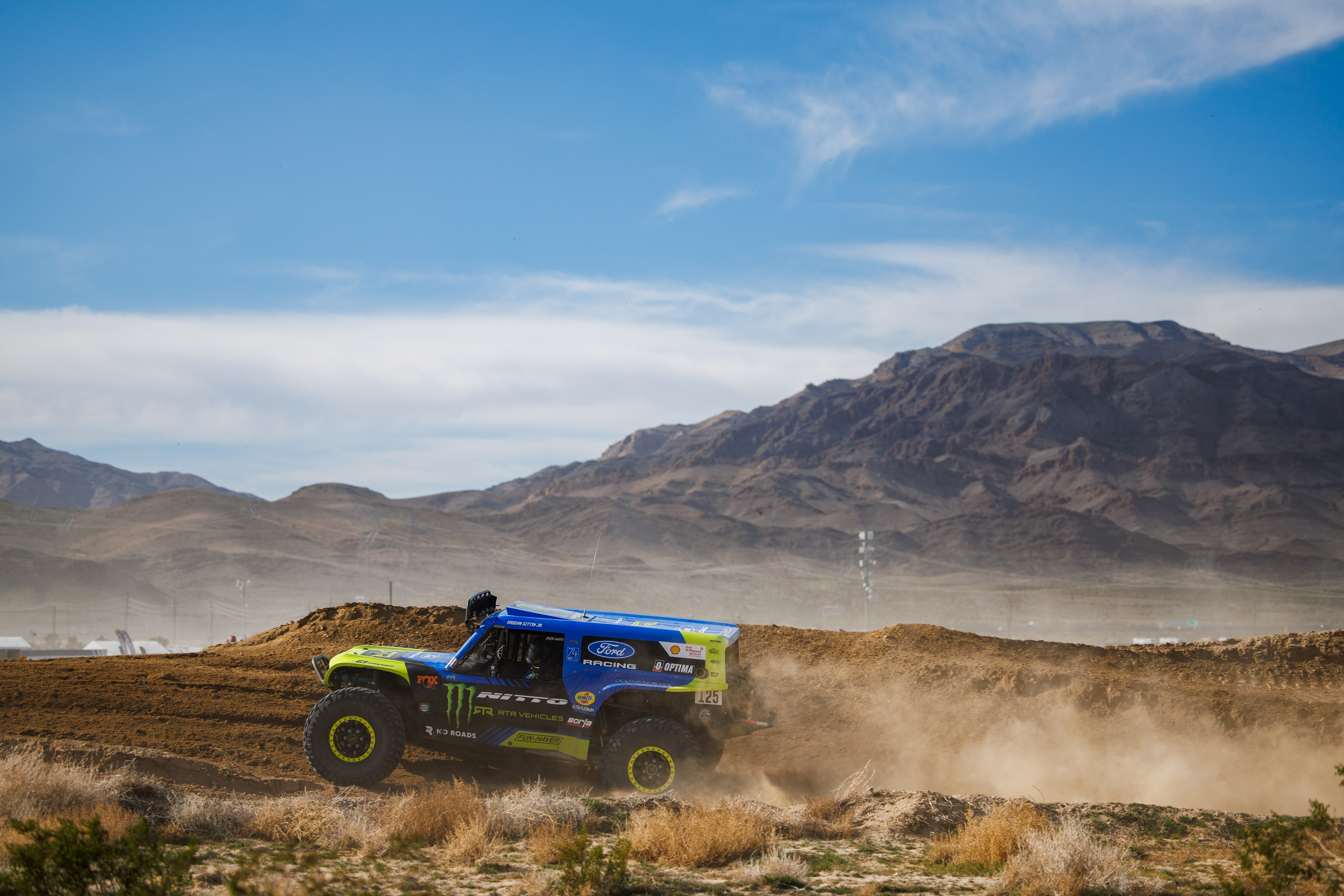 Mint 400 - Vaughn Gittin Jr wheels Raptor 4400 with mountains in background